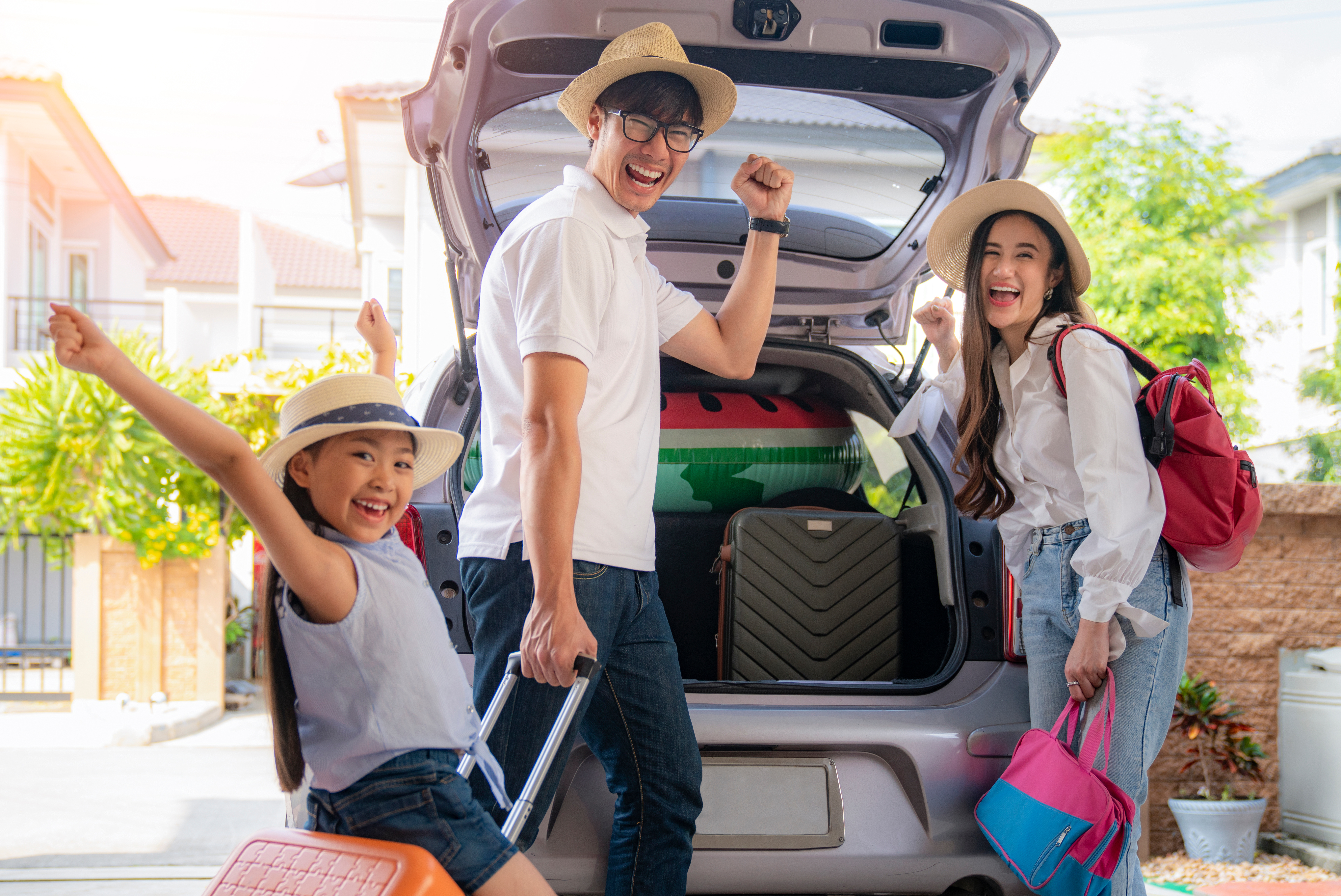 Asian Family going to holiday on summer vacation before start from home. Car travel concept.