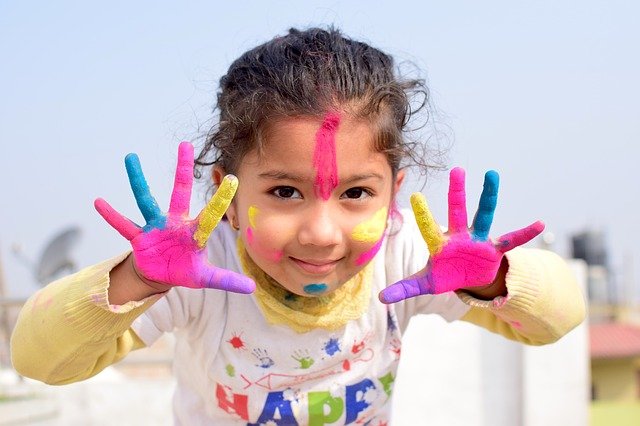 little girl fingerpainting